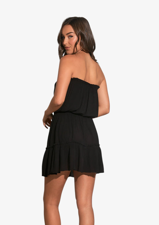 Woman wearing black strapless dress at Mimiluca Boutique.