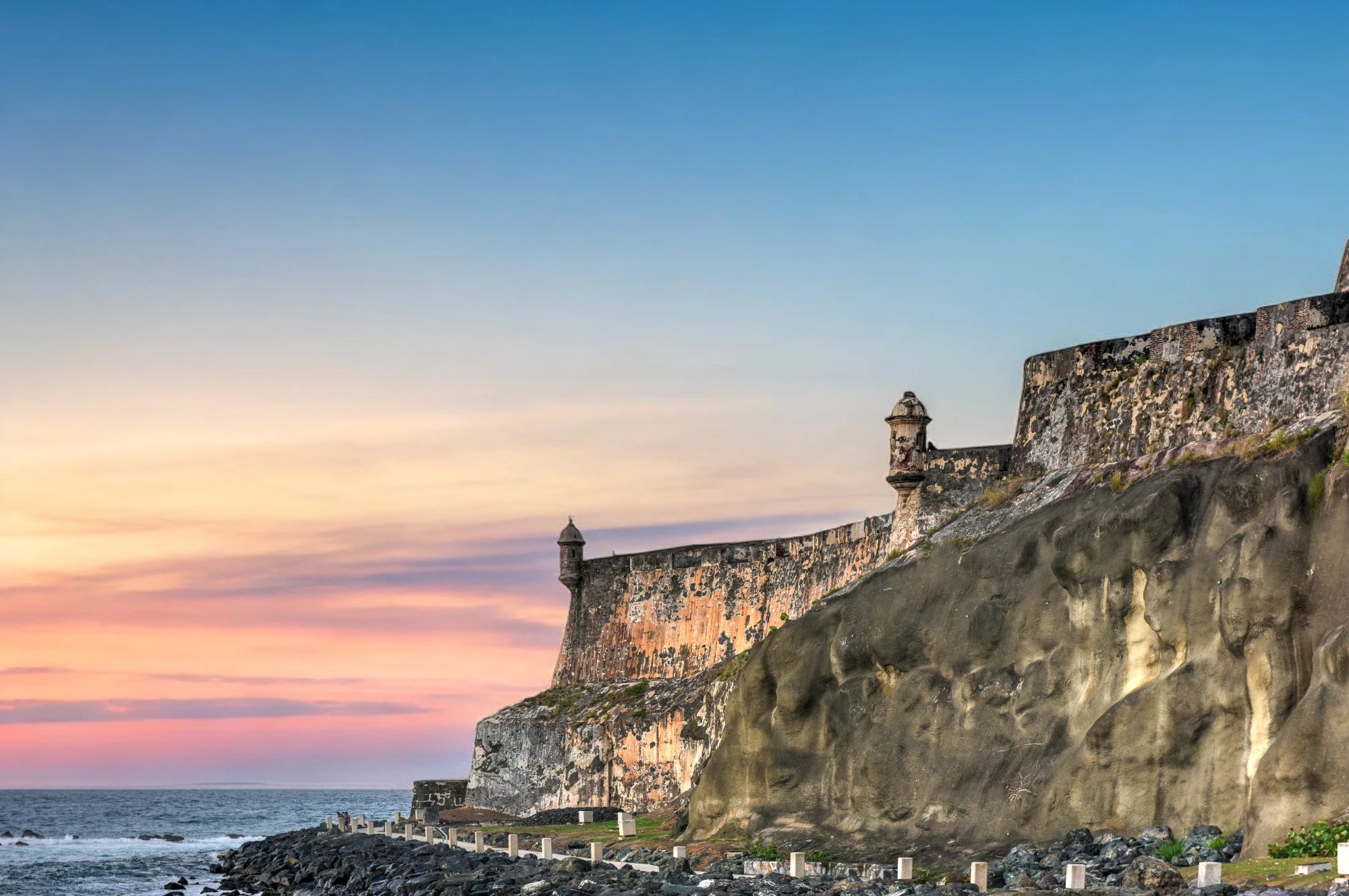 Fort San Felipe Del Morro Puerto Rico with colorful sunset and ocean.