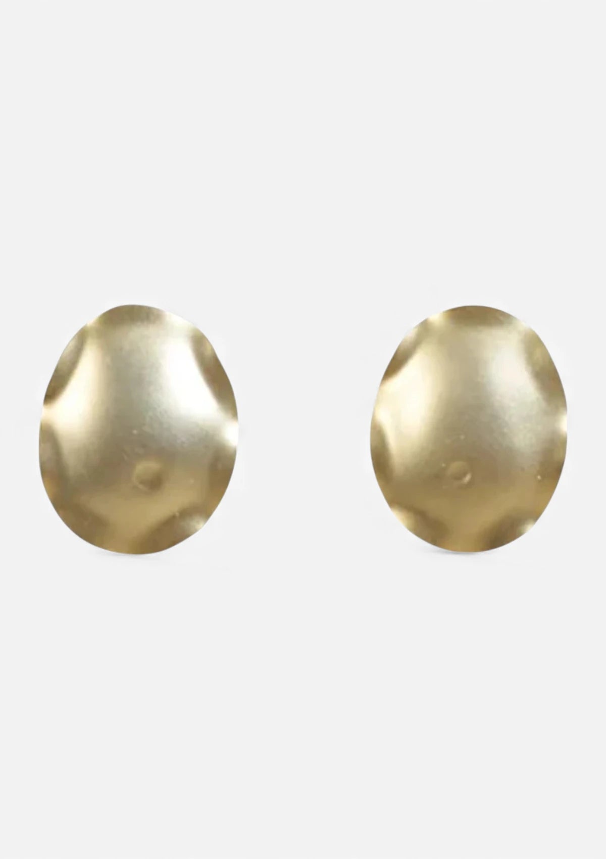 Pair of gold earrings on a white background